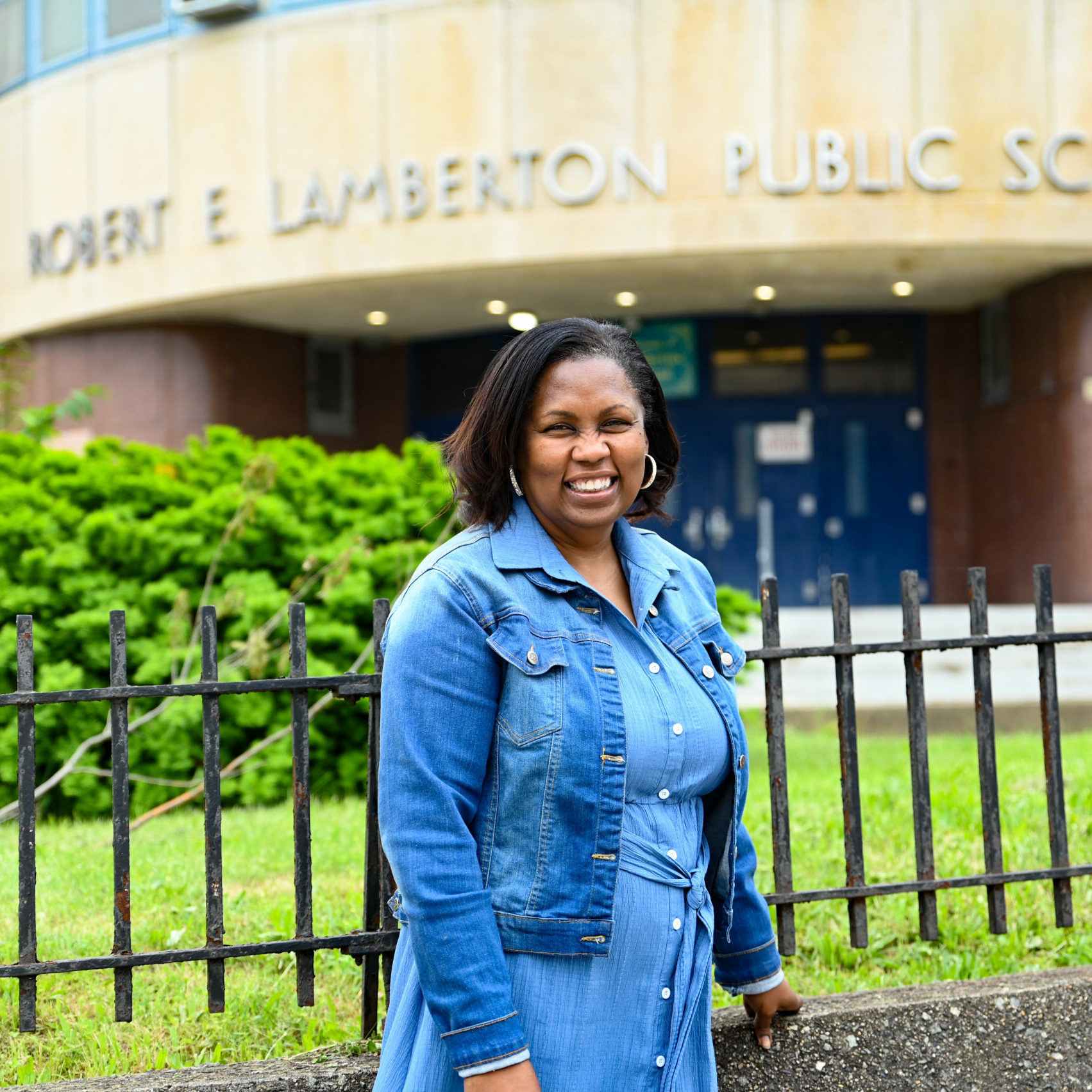 Principal Andrea Surratt smiling outside Robert E. Lamberton Public School.