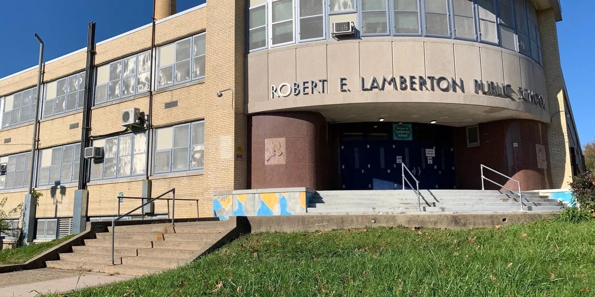 Exterior of Robert E. Lamberton Public School showing the main entrance and school name above the doors.